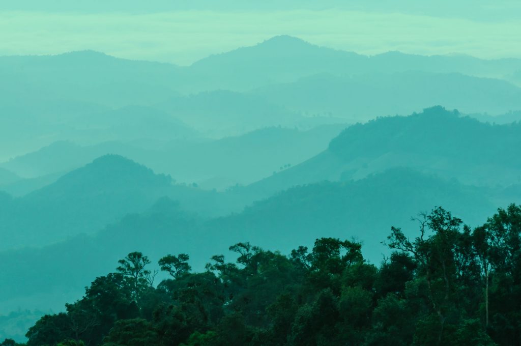 Layered green mountains stretching into the distance
